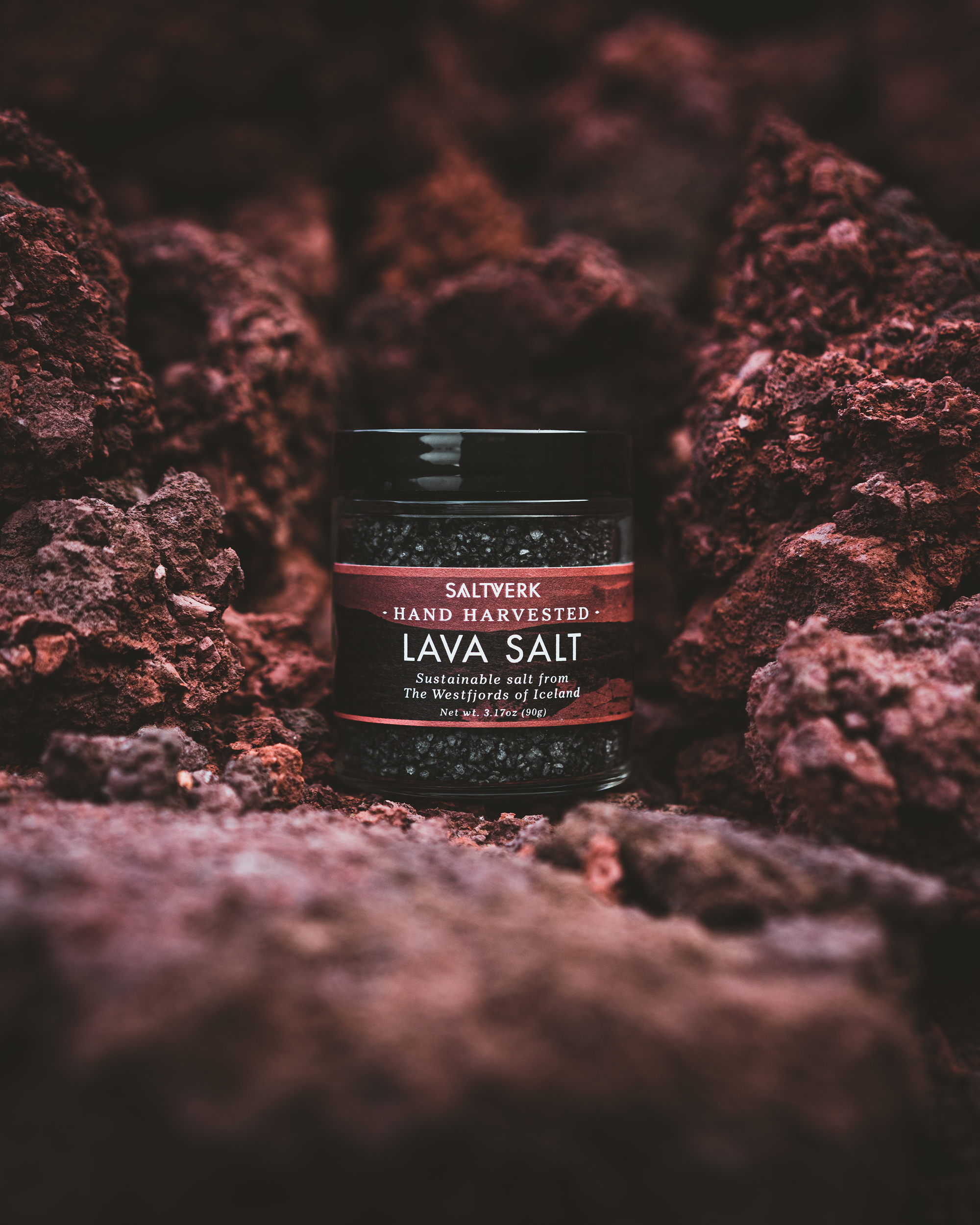 Jar of Saltywerk Lava Salt on a textured brown background