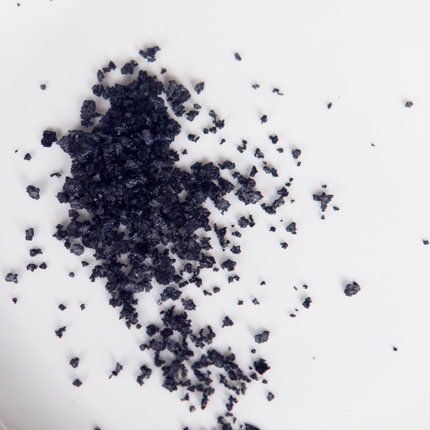 Black granules on a white background
